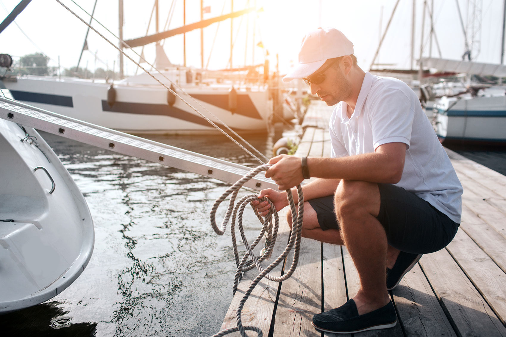 Man tying up boat at Beacon Bay Marina on Georgian Bay